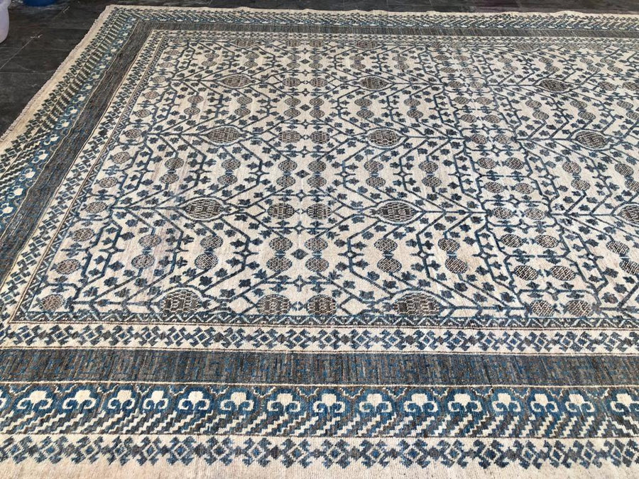 Discover the heritage woven into Busra Handcrafted Antique Khotan Rug, an exquisite piece for your decor.
