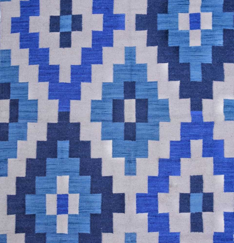 Explore the precision in the weaving process of Blue Jaal Flatweave Dhurrie Rug, a masterpiece of craftsmanship.